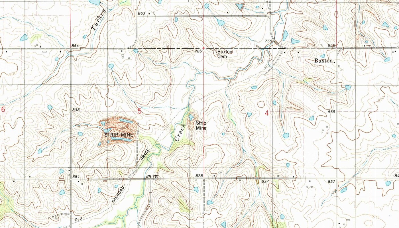 Detail of the 1982 U.S. Geological Survey map of the Buxton quadrangle, showing the label Buxton, Buxton Cemetery, an old railroad grade and two strip mines among fields
