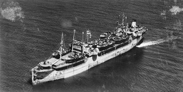 The tanker Esso Manhattan at sea in 1943, her deck loaded with PT boats