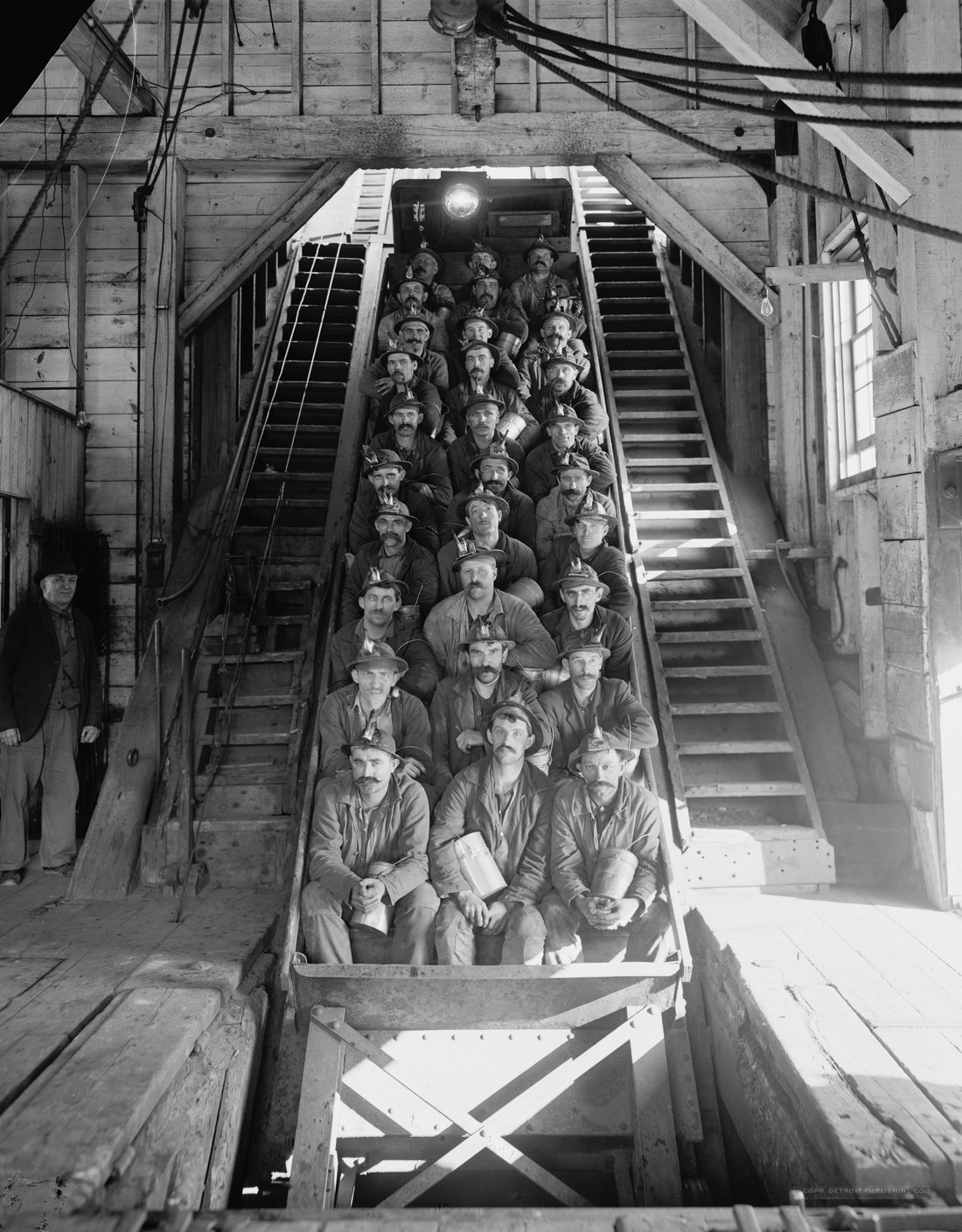 Miners riding a man car up the incline at Calumet and Hecla shaft No. 2, around 1906