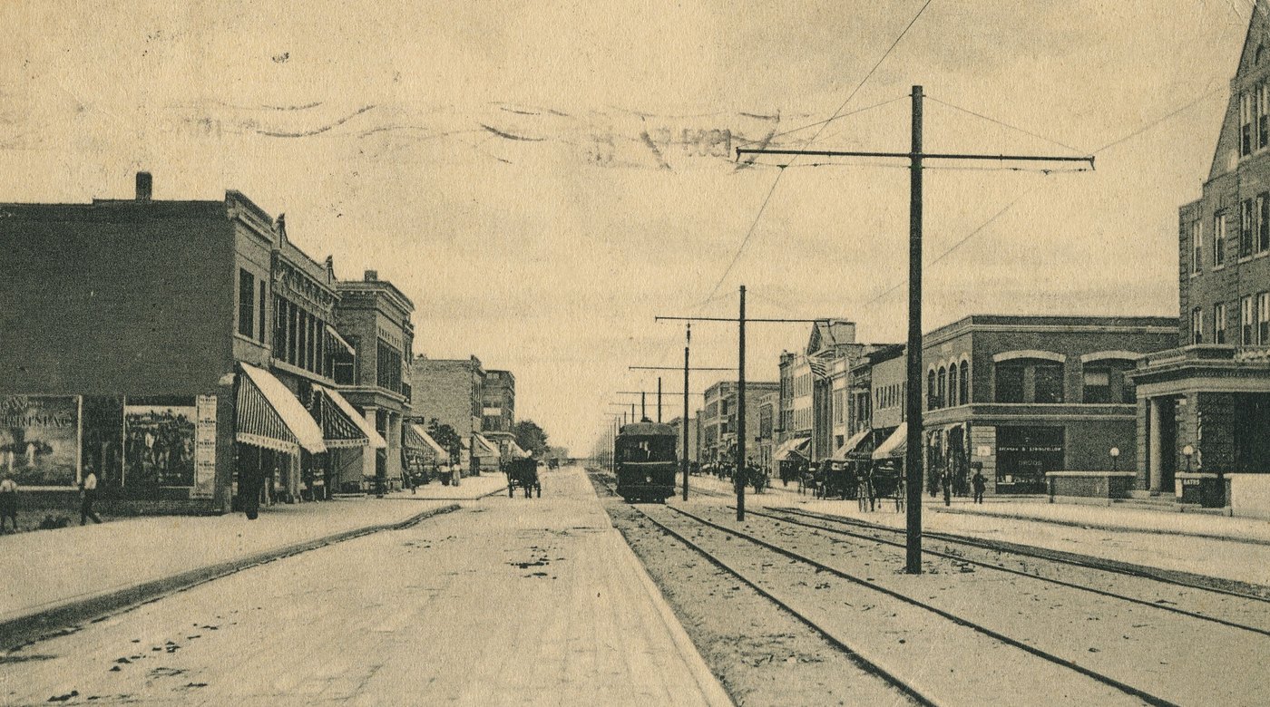 Sixth Avenue and Broadway, Gary, in August 1908, with a streetcar and new brick shops