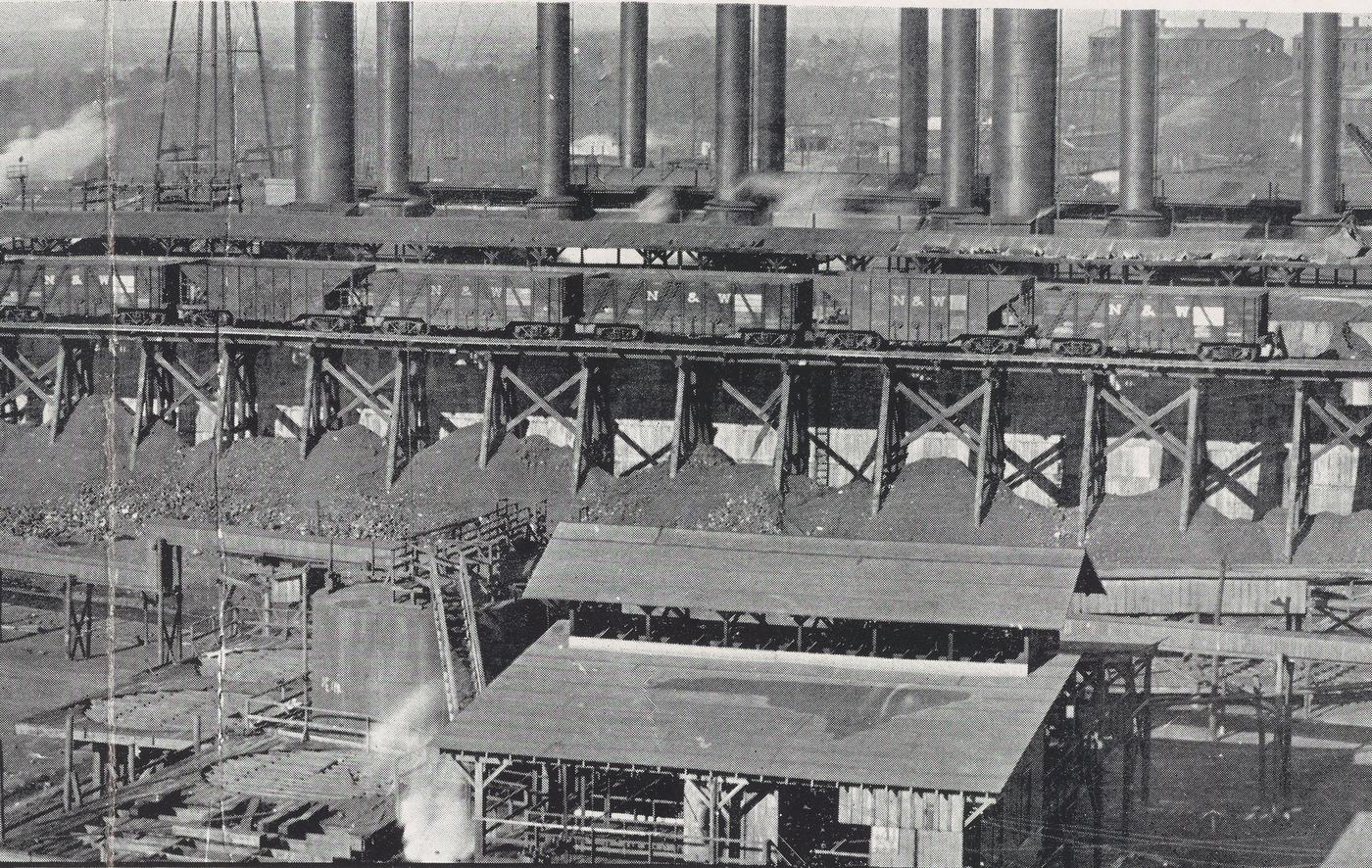 The DuPont guncotton works at Hopewell: a row of tall power-house stacks above a coal trestle loaded with railway wagons
