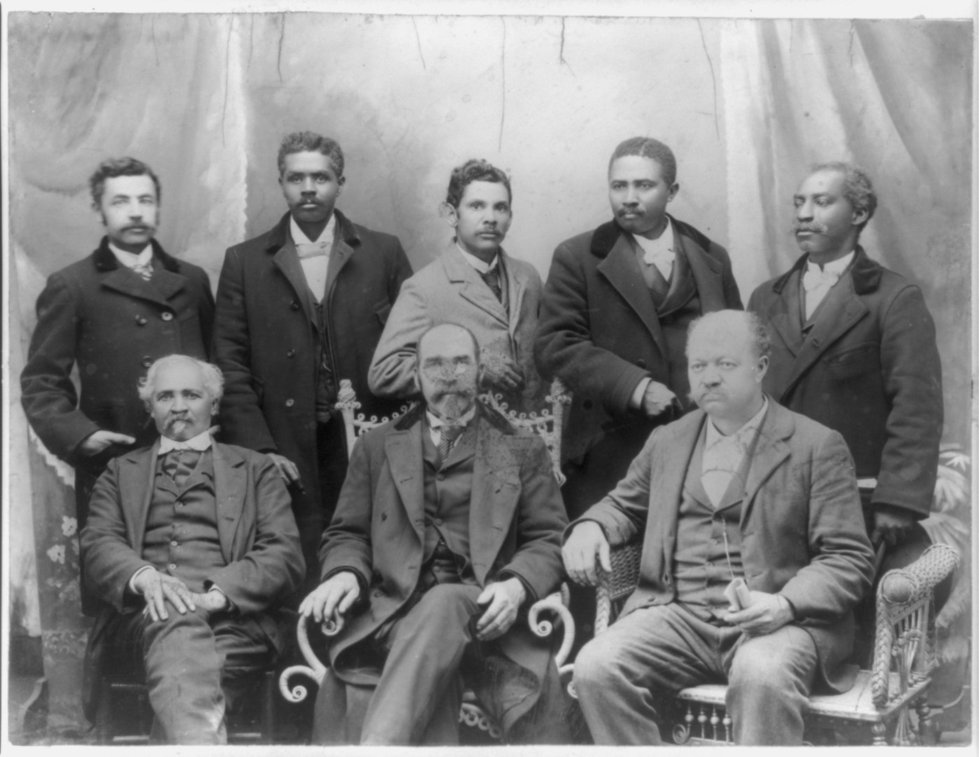 The eight directors of the Coleman Manufacturing Company photographed in a studio about 1899