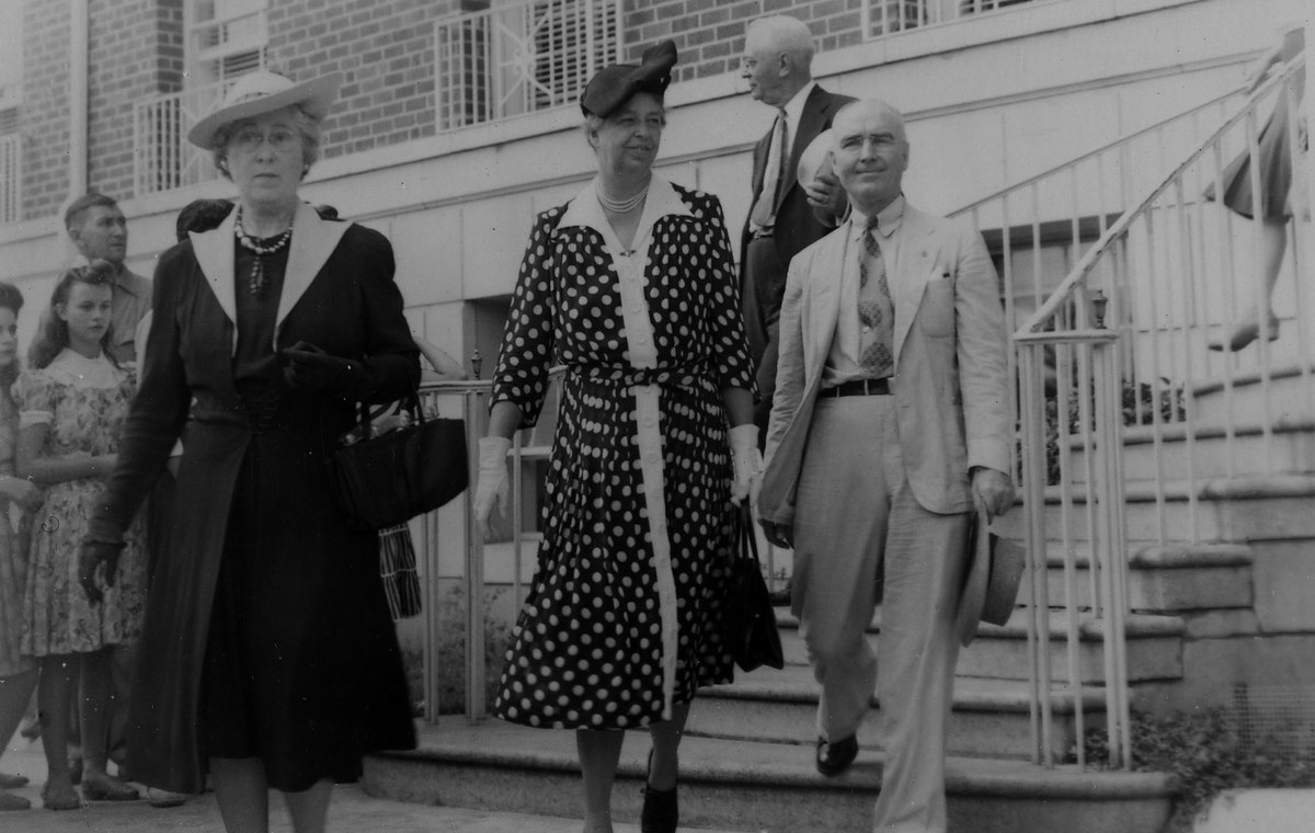 Eleanor Roosevelt leaving the YMCA at Kannapolis, North Carolina, in August 1942, watched by mill families