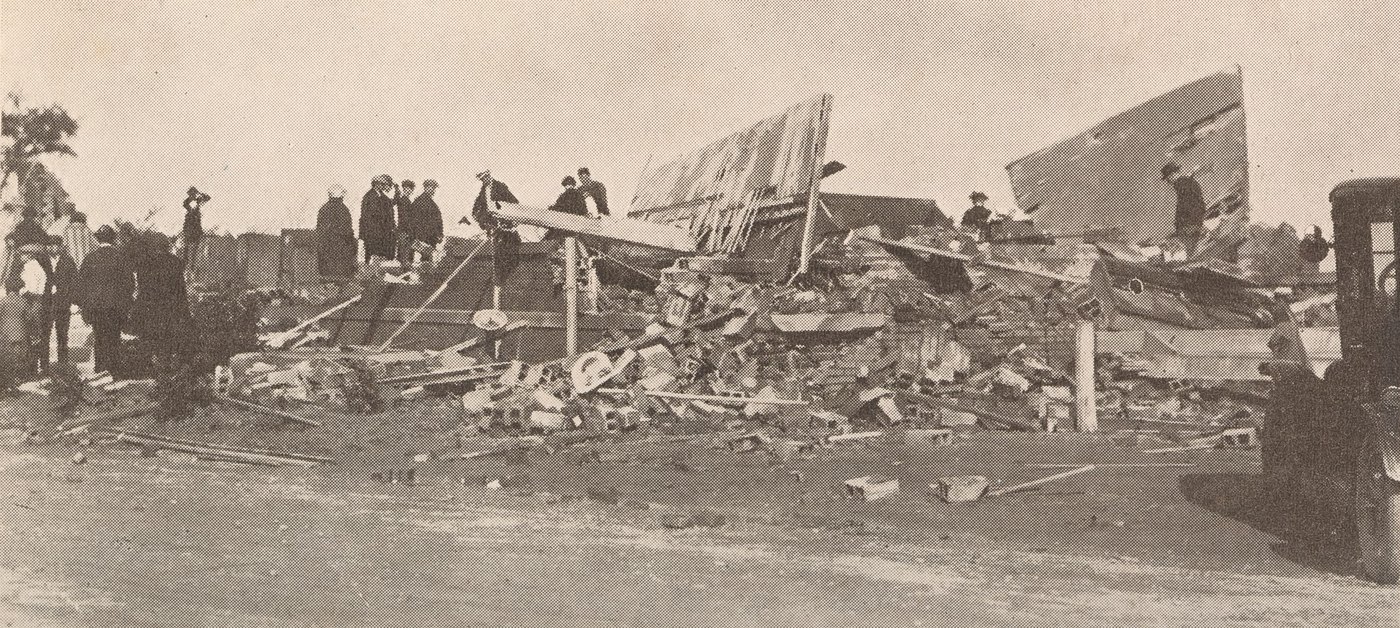 Men standing on the wreckage of the Lakeview Park bath house in Lorain after the 1924 tornado